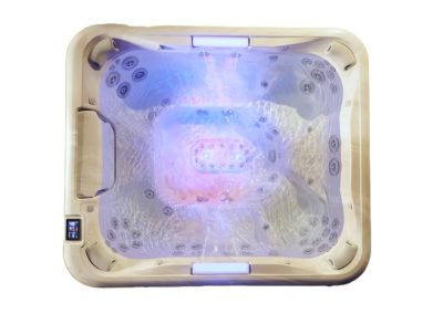 Square hot tub viewed from above with multiple jet seats and blue/purple LED lighting inside