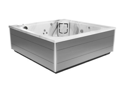 Rectangular outdoor hot tub with gray siding and a white interior, visible jets and seating edge