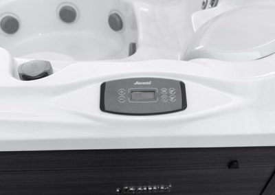 Control panel on a white spa/hot tub with a digital display and control buttons